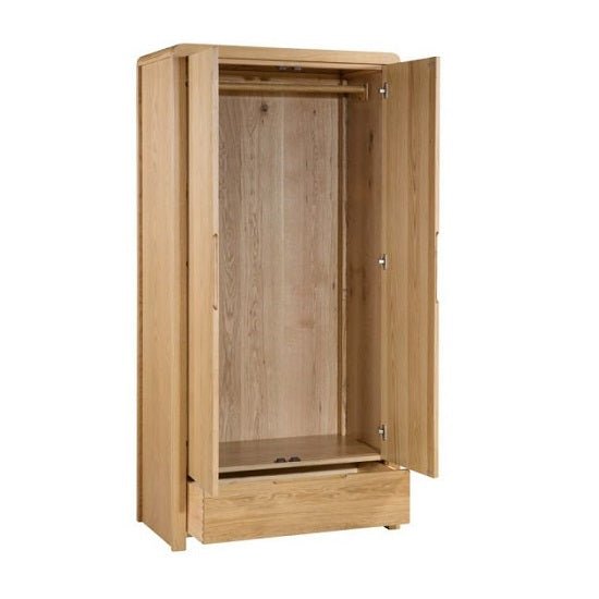 Natural waxed oak wooden wardrobe with 2 doors, hanging rail and bottom drawer.
