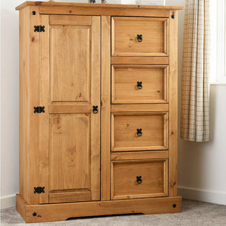 The CHOICEWARDROBE Central 1 Door 4 Drawer Solid Pine Wardrobe, with black metal handles and a classic country style finish, stands on a carpeted floor near a window with beige curtains.