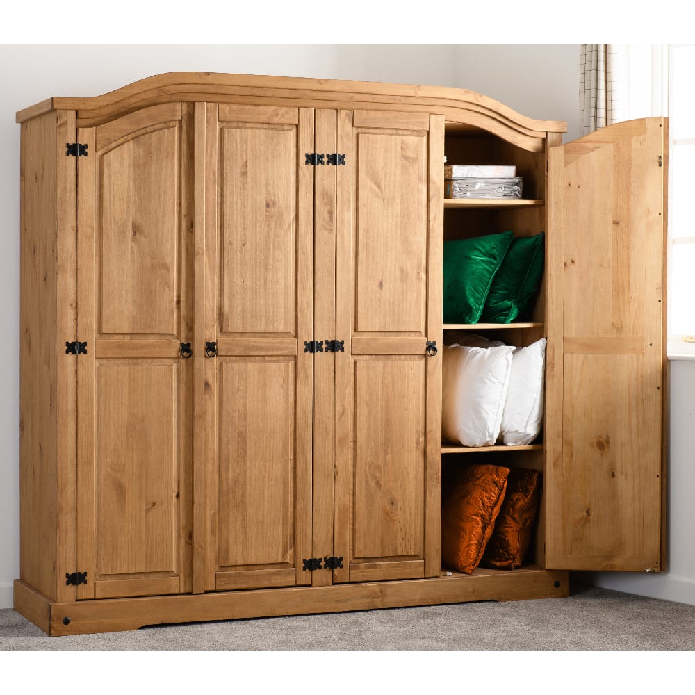 CHOICEWARDROBE Central 4-door wooden wardrobe in natural oak with rustic design, one door open showing shelves with pillows.