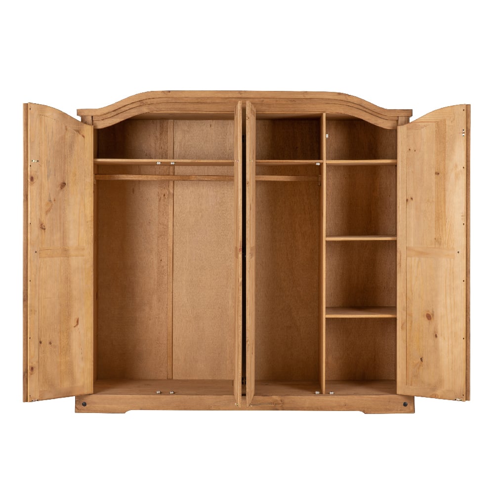 Interior of CHOICEWARDROBE Central 4 Door Oak Wardrobe, showing a hanging rail and wide shelving compartments.