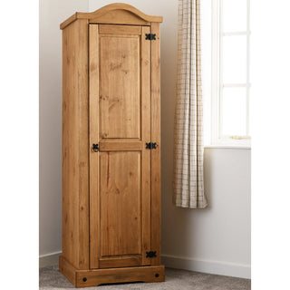 The CHOICEWARDROBE Central 51cm Solid Wooden Single Door Wardrobe in classic oak finish features black metal hinges and a curved top, providing rustic bedroom storage with a hanging rail.