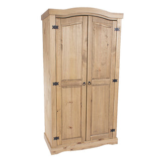 The CHOICEWARDROBE Consett 2 Door Wooden Wardrobe features a natural pine finish, rustic paneled design, curved top, metal hinges, and round handles. Its 100cm width makes it ideal for adding classic style to any bedroom.