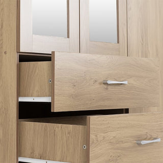 A close-up view of the CHOICEWARDROBE Crieff Oak Effect 3 Door Mirrored Wardrobe, featuring two drawers, silver handles, a hanging rail, and mirrors on the doors above the drawers.