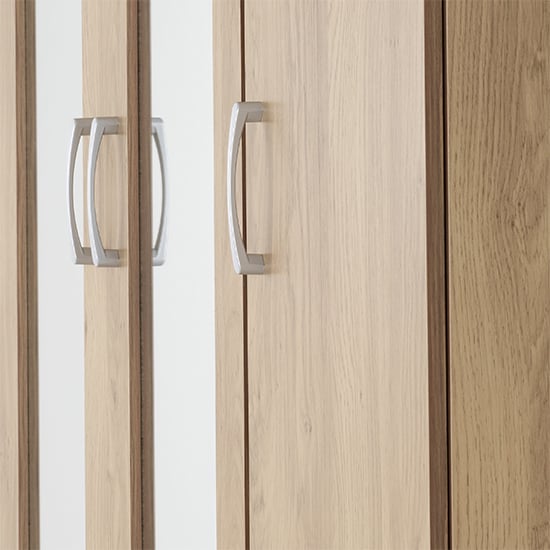 CHOICEWARDROBE Crieff Oak Effect 3-door wardrobe metallic handles aligned vertically.