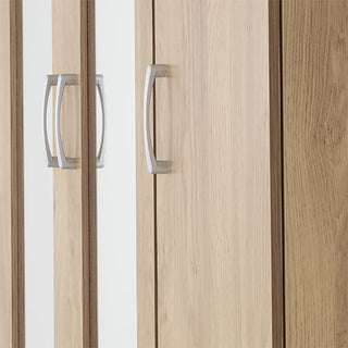 Close-up of the metallic handles on the CHOICEWARDROBE Crieff Oak Effect 3 Door Mirrored Wardrobe, vertically aligned across the doors. A subtle reflection appears on one mirrored door of this modern wardrobe with drawers and hanging rail.