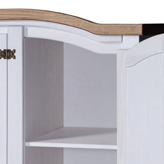 A close-up of the CHOICEWARDROBE Croydon 4 Door Wooden Wardrobe in white with an oak top shows its open door, revealing an interior shelf and metal hinge—classic rustic bedroom storage.