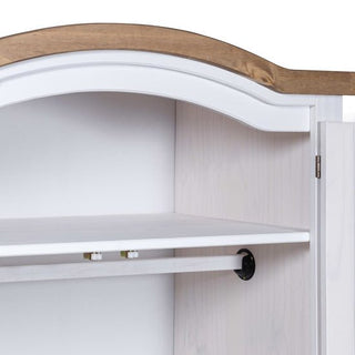 A close-up of the CHOICEWARDROBE Croydon White & Oak 2 Door Wardrobe shows its arched top design, antique brass detailing, open door, a single interior shelf, and a hanging rod mounted beneath the shelf.