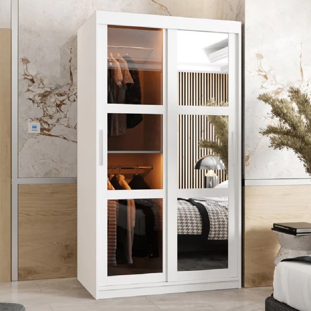 White modern wardrobe with mirrored sliding doors showing internal clothes hanging and shelving.