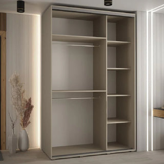 The CHOICEWARDROBE Delta 3 Door Sliding Wardrobe in Cashmere with black trim and shelving storage (150cm wide) stands in a minimalist room with vertical wall panels and a decorative vase of dried plants nearby.