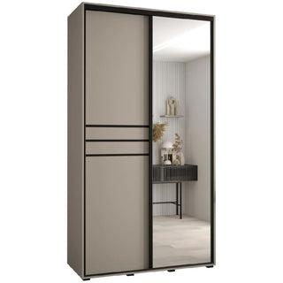 The CHOICEWARDROBE Delta Mirrored Sliding Door Wardrobe, 140cm in cashmere with black trim, features one mirrored door and stands in a neutrally decorated room reflecting tasteful decorative objects.