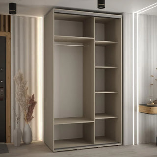 The CHOICEWARDROBE Delta Mirrored Sliding Door Wardrobe, 140cm cashmere finish with black trim and full-length mirror, features open shelves, a hanging rod, and cubbies. It stands in a modern room with vertical panels, dried plants, and a console table.