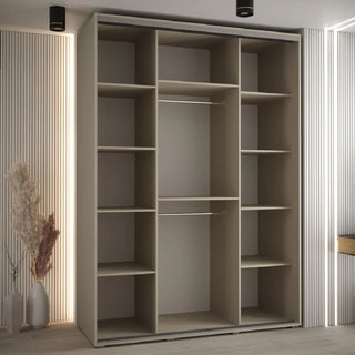 The CHOICEWARDROBE Delta Mirrored Sliding Door Wardrobe (170cm, 3 doors) in modern beige with a black frame and central full-length mirror stands against paneled walls, featuring shelves and hanging rods—ideal for contemporary UK bedrooms.