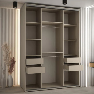 A UK bedroom essential, the CHOICEWARDROBE Delta Mirrored Sliding Door Wardrobe has 3 doors, a modern beige finish with black frame detailing, a central full-length mirror, and ample storage. It stands against vertical panel walls with dried plants nearby.