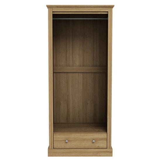 Oak effect wardrobe with hinged doors, internal hanging rail and a lower drawer.