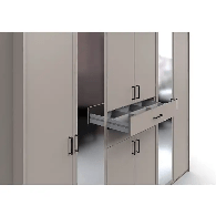 Close-up of Docker grey wardrobe drawers showing smooth pull design, mirror reflection, and modern craftsmanship for premium bedroom storage.