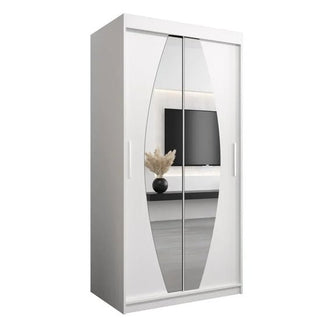 The CHOICEWARDROBE Eden 100cm White Mirrored Sliding Door Wardrobe with curved mirrors reflects a wall-mounted TV, console, and vase, adding elegance and style to a minimalist bedroom with its modern design, shelves, and hanging rail.