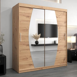 The CHOICEWARDROBE Eden 180cm Oak Mirrored Sliding Door Wardrobe, with a curved mirror design, hanging rail, and storage shelves, stands in a modern bedroom reflecting the TV, shelf, and decor in its mirrored doors.