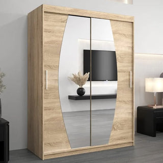 The CHOICEWARDROBE Eden 2 Door Mirrored Sliding Wardrobe (150cm, oak finish) with curved mirrors, shelving, and smooth sliding doors enhances bedroom storage while reflecting modern decor for a stylish space.
