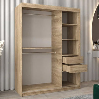 The CHOICEWARDROBE Eden 2 Door Mirrored Sliding Wardrobe in oak finish features shelving, a hanging rail, and sleek curved mirrors, offering stylish and contemporary bedroom storage against a striped wall.
