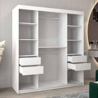 The CHOICEWARDROBE Eden 2 Door Mirrored Sliding Wardrobe in white, with elegant curved mirrors, hanging rail, and shelves, stands on a light wood floor beside a round mirror and vanity against a striped wall.