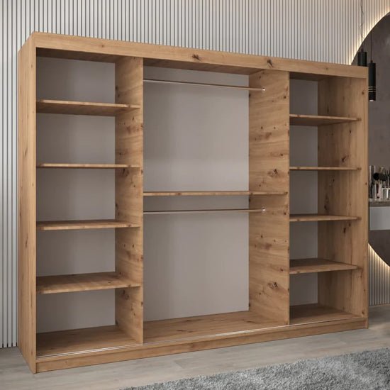 Artisan Oak sliding door wardrobe with mirrored panels and visible shelving.