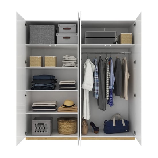 Fargo 200cm white high gloss wardrobe interior with open doors, showing shelves and hanging rails.
