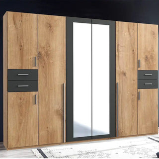 Full front view of Fenton 270cm oak and graphite mirrored wardrobe featuring six doors and integrated drawers for organised storage.