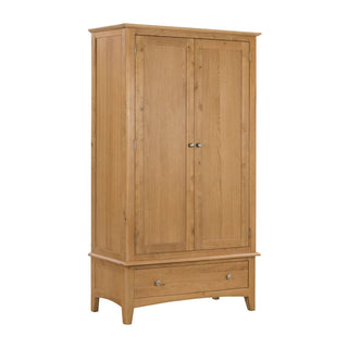 The CHOICEWARDROBE Halton 2 Door 1 Drawer Wardrobe in natural oak finish features metal handles, a spacious bottom drawer, and a simple rectangular design—ideal classic bedroom storage at 100 cm wide.