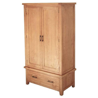 The CHOICEWARDROBE Hampshire Solid Oak 2 Door Wardrobe with Drawer has a classic natural oak finish, metal handles, a hanging rail, and a deep storage drawer—ideal for complementing solid oak or oak bedroom ranges.