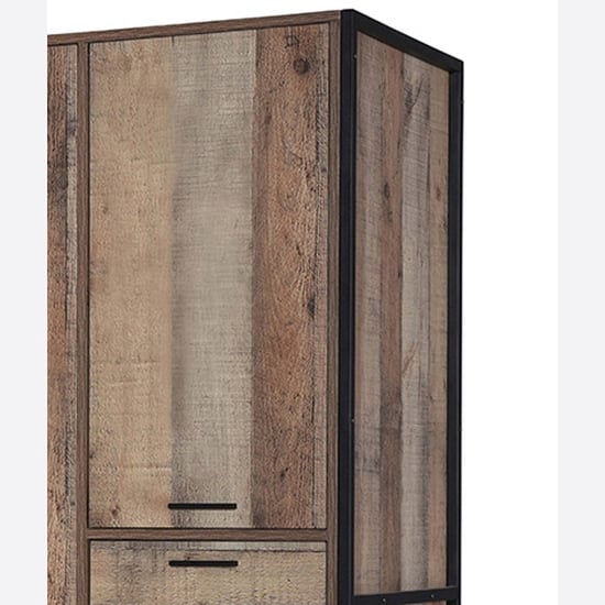 Industrial oak wardrobe with black metal frame and visible drawers
