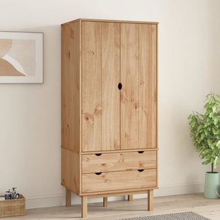 The CHOICEWARDROBE Harrow Pine 2 Door Wardrobe, featuring a minimalist Scandinavian design and natural pine finish with two drawers, stands against a light wall. A framed abstract art piece hangs to its left, and a potted plant is placed on the right.