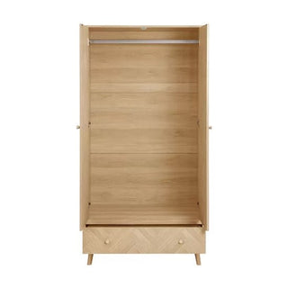 The CHOICEWARDROBE Helena 90cm 2 Door Wooden Wardrobe in a natural oak finish features a chevron pattern front, an empty interior with a hanging rod, one lower drawer, and stands on Scandinavian tapered legs.