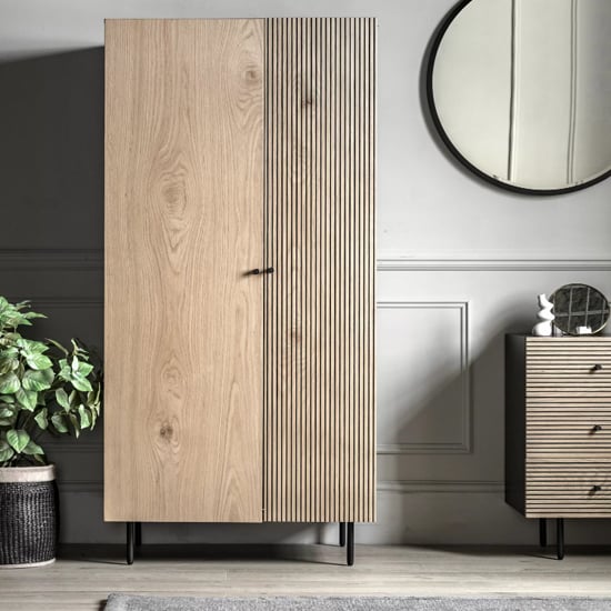 CHOICEWARDROBE Helena 2-door natural oak wardrobe with ribbed panels and black metal legs.