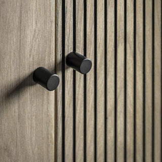 Close-up of the CHOICEWARDROBE Helena Wooden Wardrobe: 2 doors, natural oak finish, ribbed panel design, and minimalist black handles with metal legs.