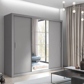 ChoiceWardrobe Inverto 3 door sliding wardrobe in matt grey with central mirror, styled in a modern bedroom interior.