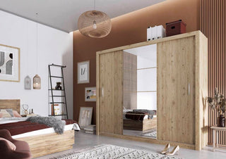 Lifestyle image of Inverto Shetland Oak wardrobe in modern bedroom setting with warm lighting and mirror reflection.