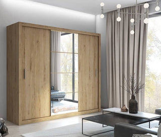 Angled view of ChoiceWardrobe Inverto oak San Remo sliding wardrobe with mirror centre and textured oak finish.