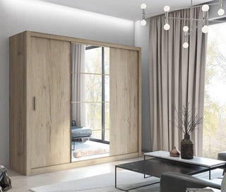 Inverto oak San Remo sliding wardrobe styled in a bright bedroom interior with central mirrored panel.