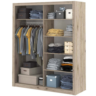 The CHOICEWARDROBE Ionia 180cm Rustic Oak Mirrored Sliding Door Wardrobe offers a natural wood finish, shelves for folded clothes, hanging rails for shirts and jackets, plus space below for boxes and bins to keep your bedroom organized.
