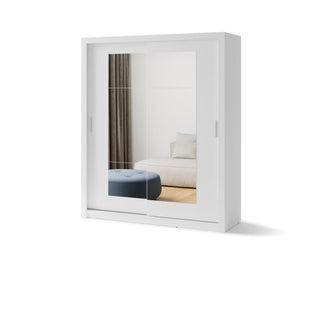 The CHOICEWARDROBE Ionia 2 Door Mirrored Sliding Wardrobe in matt white (180cm) saves space while reflecting a bedroom styled with a bed, white pillows, blue ottoman, wooden flooring, and curtains.