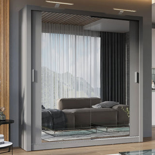 The CHOICEWARDROBE Ionia 2 Door Mirrored Sliding Wardrobe in Grey with LED lights and storage shelves reflects a modern living room with a sofa, pillows, large windows, curtains, mountain view, and a wooden panel ceiling.