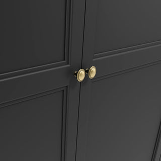 Close-up of CHOICEWARDROBE Iowa 2 Door Wooden Wardrobe in matte black, featuring a panelled shaker design, gold handles, and a lower drawer. Lighting accentuates its smooth finish and classic cabinetry details.