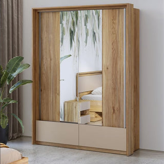 The CHOICEWARDROBE Irving Mirrored Sliding Wardrobe in Mauvella Oak stands on a light floor beside a green plant, its central mirror reflecting a bed, nightstand, and leafy decor—delivering modern bedroom storage with elegant style.