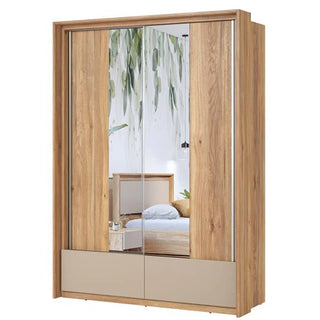 The CHOICEWARDROBE Irving Mirrored Sliding Wardrobe in Mauvella Oak stands in the room, its central mirrored doors reflecting a bed, green plant, nightstand, and white wall while offering modern and stylish bedroom storage.