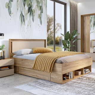 A modern bedroom featuring a wooden bed frame, beige headboard, gray-white bedding, mustard yellow throw, large window, leafy wall art, indoor plant, rug, nightstand with lamp, and a CHOICEWARDROBE Irving Mirrored Sliding Wardrobe in Mauvella Oak.