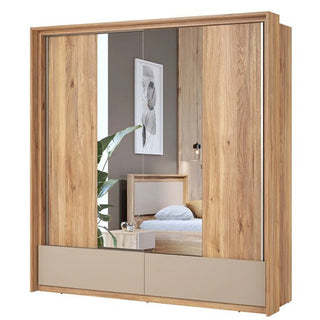 A CHOICEWARDROBE Irving Wide Mirrored Sliding Door Wardrobe in Mauvella Oak (209cm, 2 doors, drawers & shelving) stands in a bedroom, reflecting a bed, wall art, and a plant.