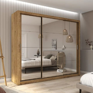 A bedroom featuring the CHOICEWARDROBE Ithaca 250cm Oak & Mirror Sliding Door Wardrobe—three doors with full mirrored panels—reflects a neatly made bed, pendant lights, wall decor, and neutral-toned furnishings.