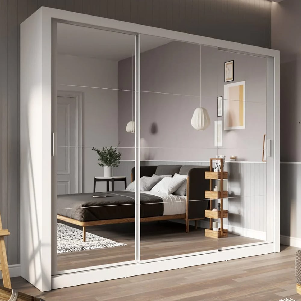 White 3-door sliding wardrobe with mirrored doors, reflecting a modern bedroom.
