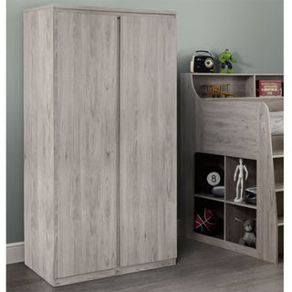 A CHOICEWARDROBE Jadiel 2 Door Wardrobe in Grey Oak Finish stands beside a matching bunk bed with open shelves for toys and books. The room features grey walls and a wood floor.