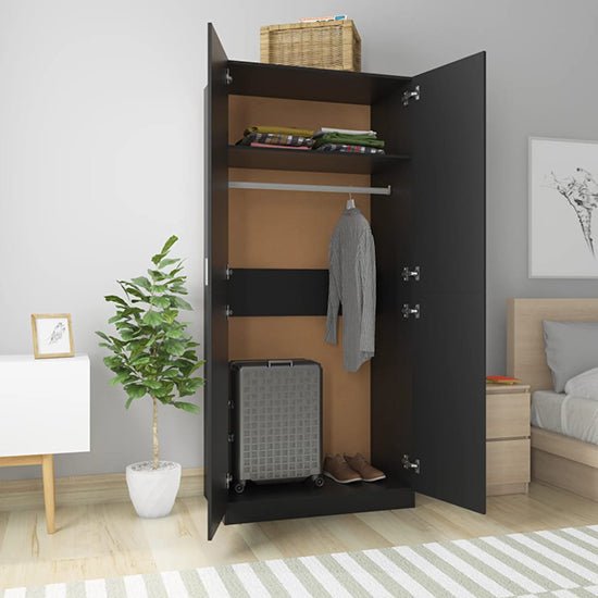 CHOICEWARDROBE Kaylor Black 2 Door Wardrobe, open showing shelves, hanging shirt, suitcase, and basket on top.